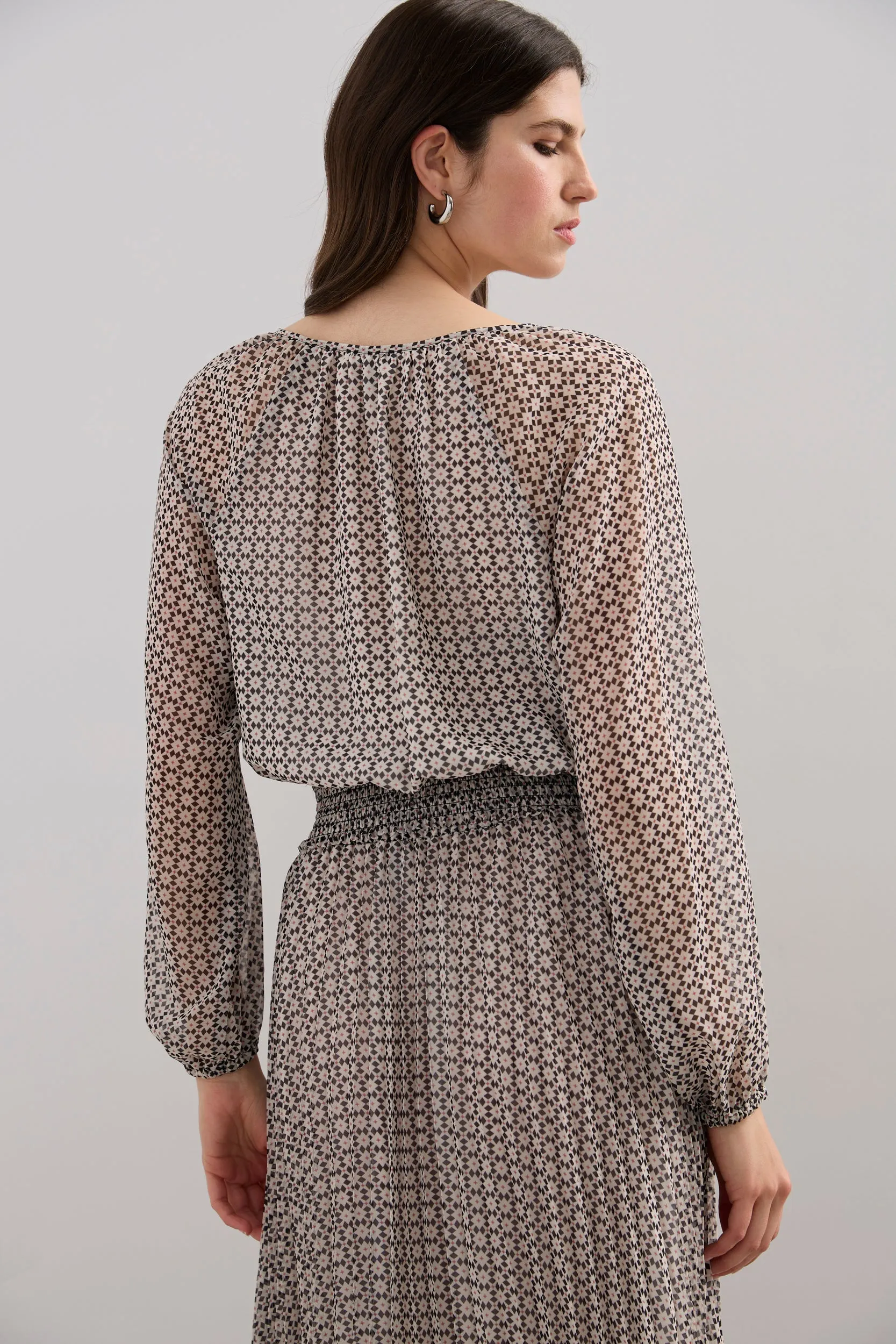 Blouse with fitted waistband