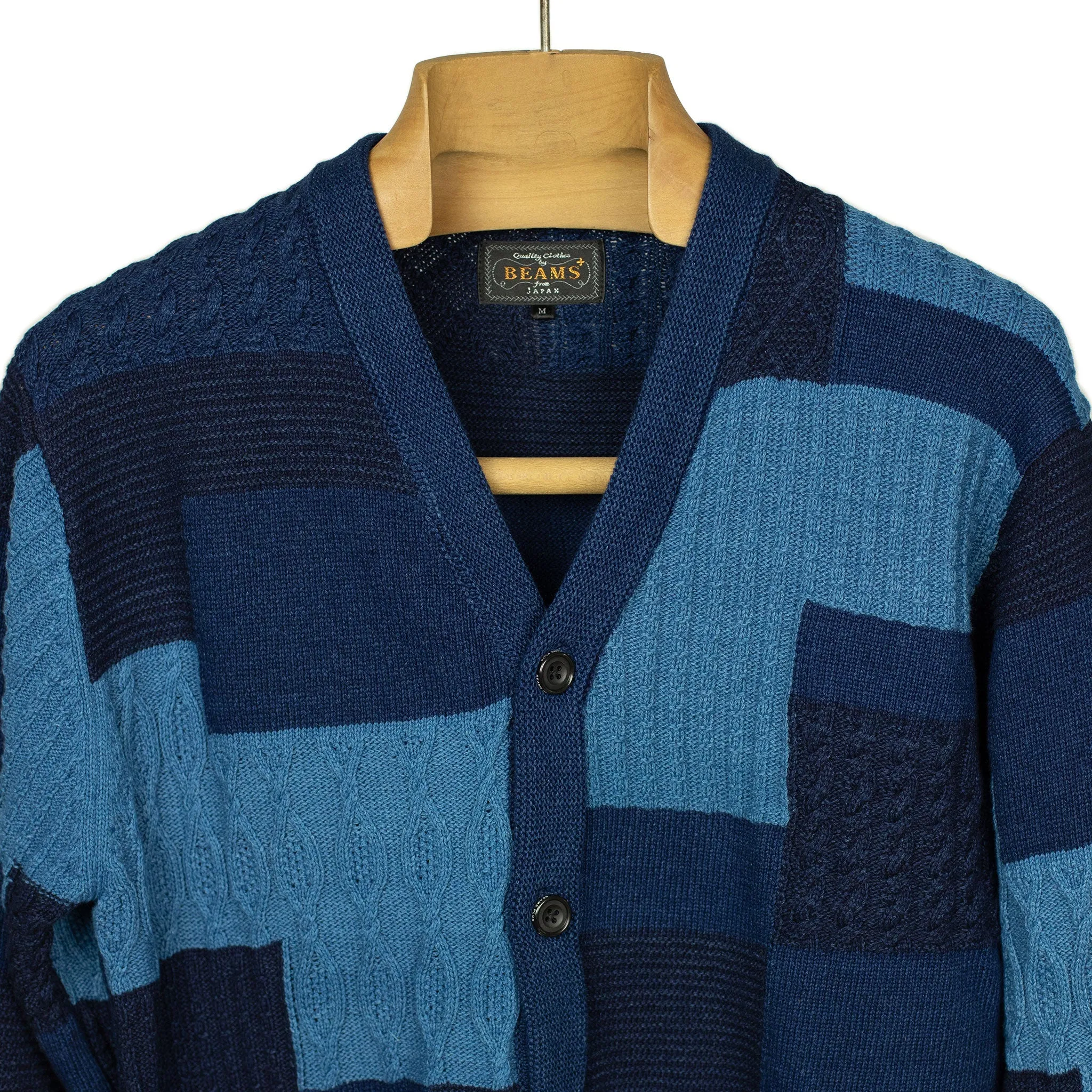 Crazy patchwork cable knit cardigan in indigo-dyed cotton