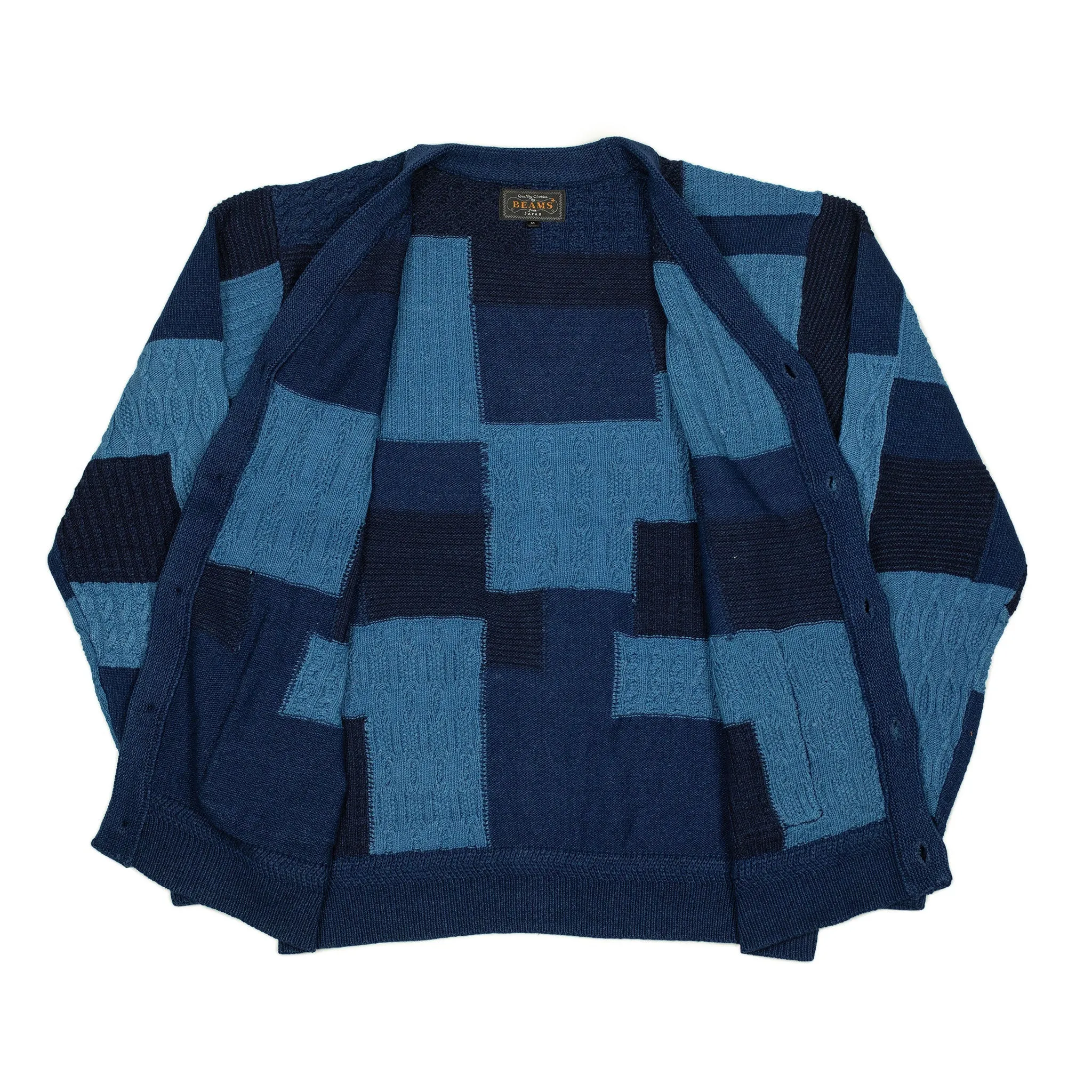 Crazy patchwork cable knit cardigan in indigo-dyed cotton