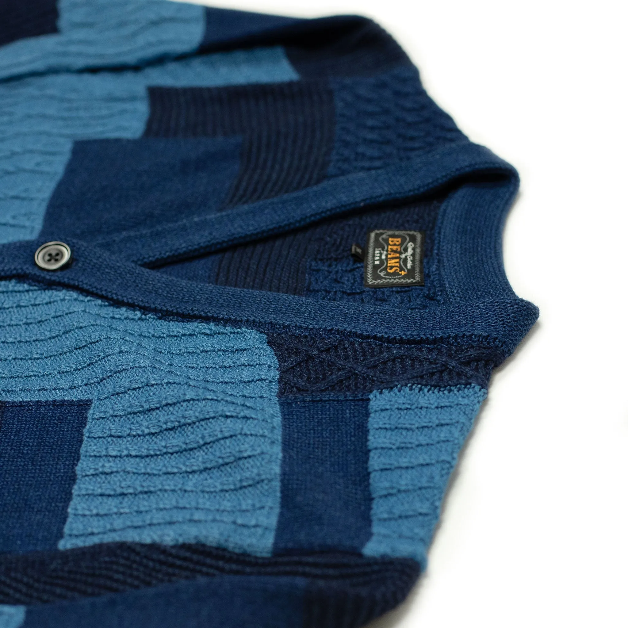 Crazy patchwork cable knit cardigan in indigo-dyed cotton